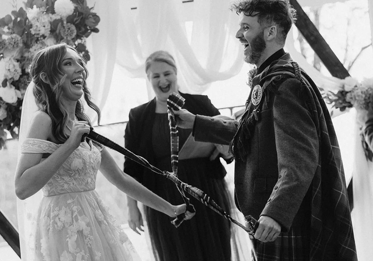 Yvonne Hannah, a humanist celebrant with Fuze Ceremonies, sits at a table on Penicuik Estate.