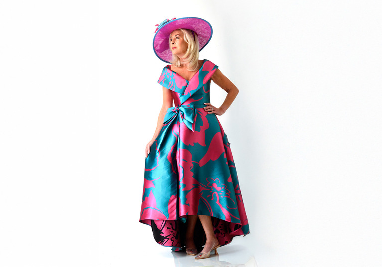 Teal and fuchsia statement occasion dress with wide brim hat
