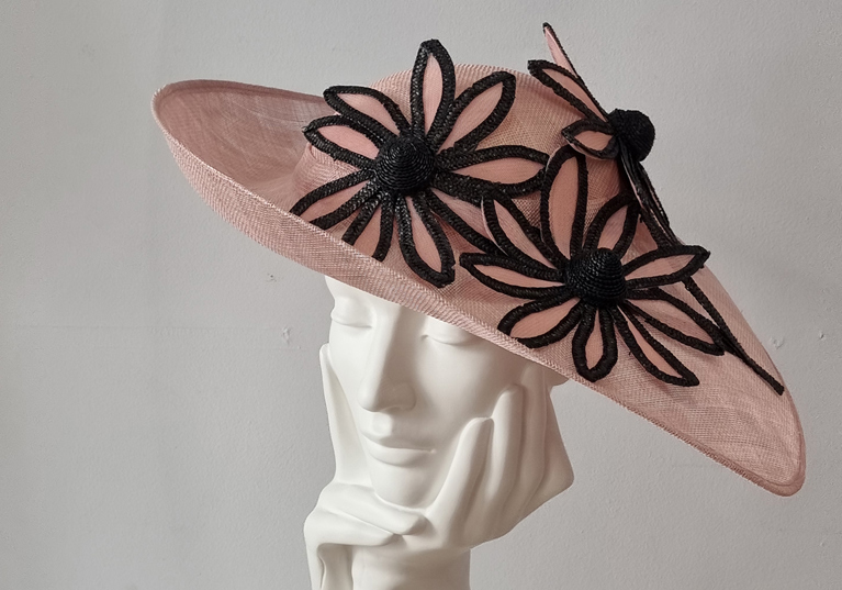 Pink hat with black flowers at Hazel Goodwin Millinery in Glasgow