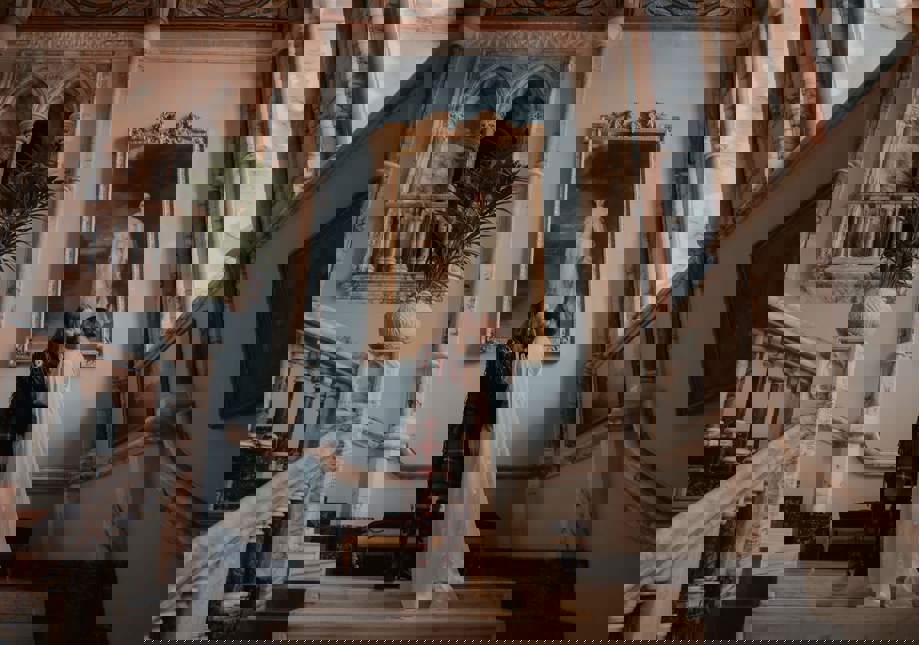 The newly wed couple sharing a quiet moment together on the marble staircase before being called into dinner