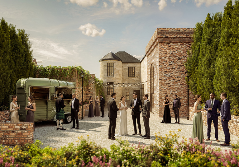 Wedding drinks reception in the walled garden at The West Works Glasgow, with guests gathered beside a mobile bar and festoon lights