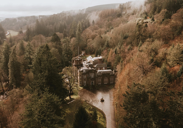 Drumtochty Castle and surrounding woodlands photographed from above.