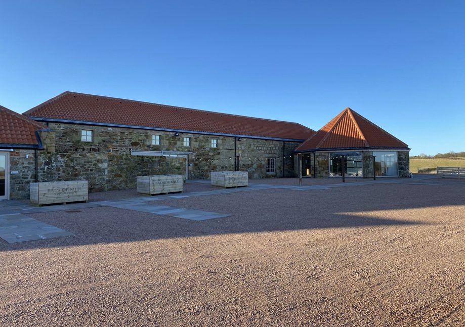 Falside Mill wedding venue exterior with stone buildings, red tiled roof and courtyard