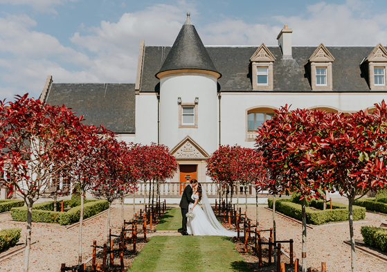 Bride and groom portrait in formal gardens at Ingliston Estate and Country Club in Bishopton