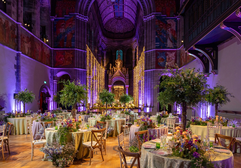 Wedding reception set up inside Mansfield Traquair with purple uplighting