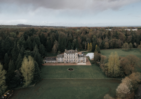 Aerial view of Melville Castle and its surrounding Scottish estate and grounds.