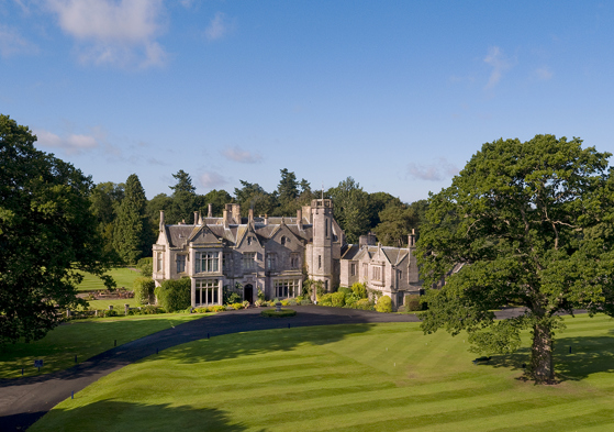 Exterior view of Schloss Roxburghe in the Scottish Borders, a country house hotel wedding venue with manicured lawns.