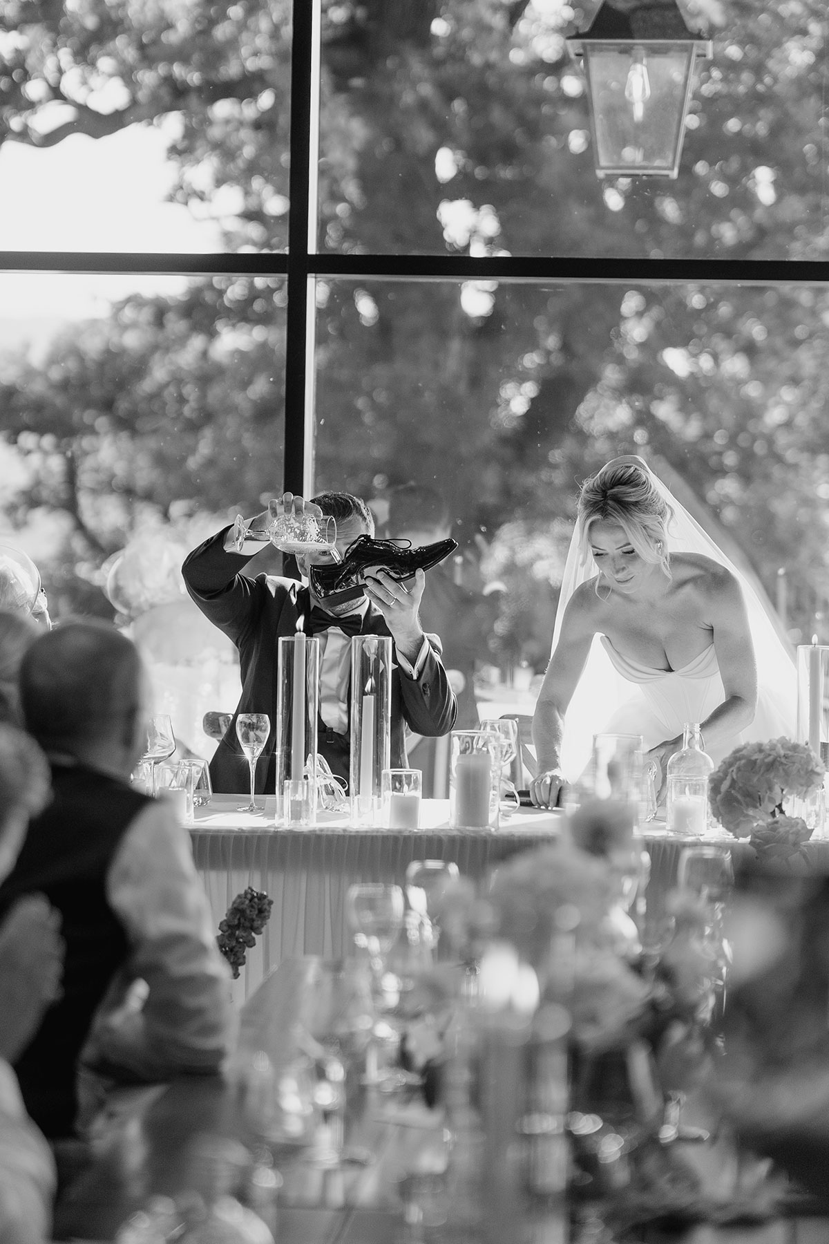 Groom takes part in the Australian 'shoey' wedding tradition during speeches at Boturich Castle reception 