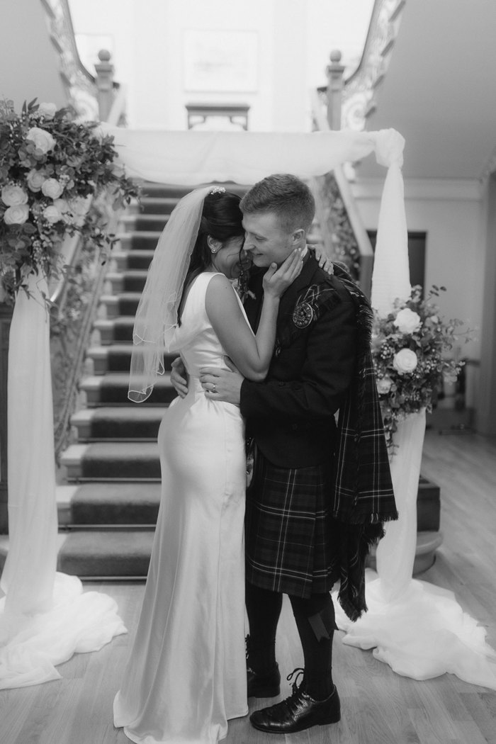 black and white photograph of bride and groom at kilmardinny house in bearsden