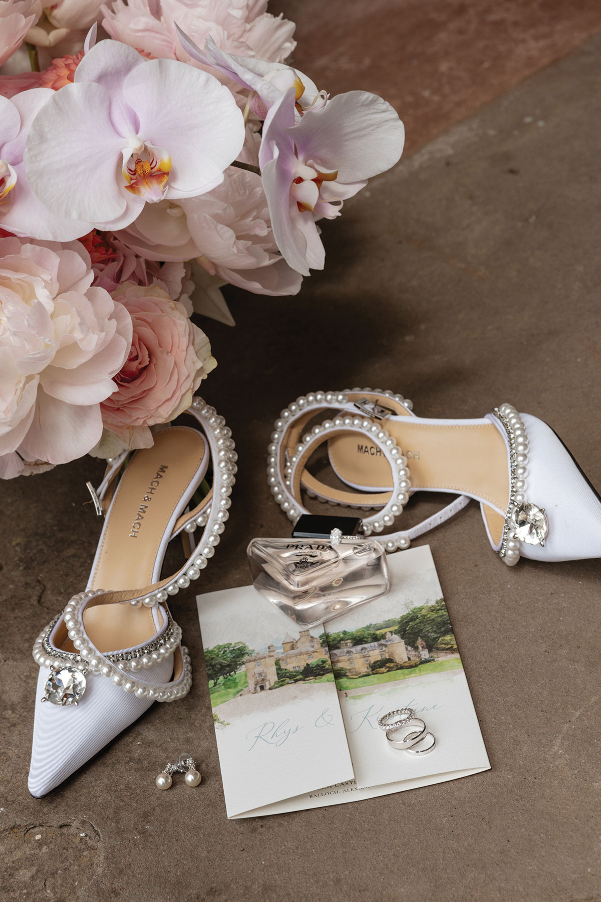 Bridal details including Mach & Mach wedding shoes, bouquet, invitation suite, wedding rings and perfume at Boturich Castle.