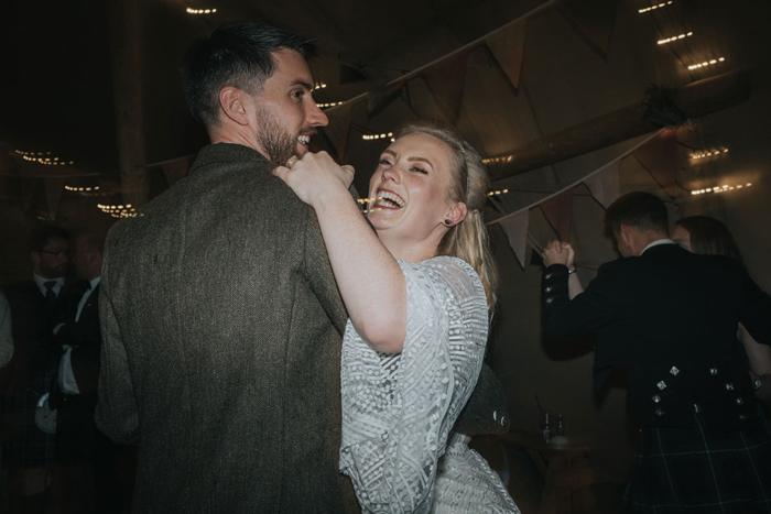 Couple spin each other on the dancefloor
