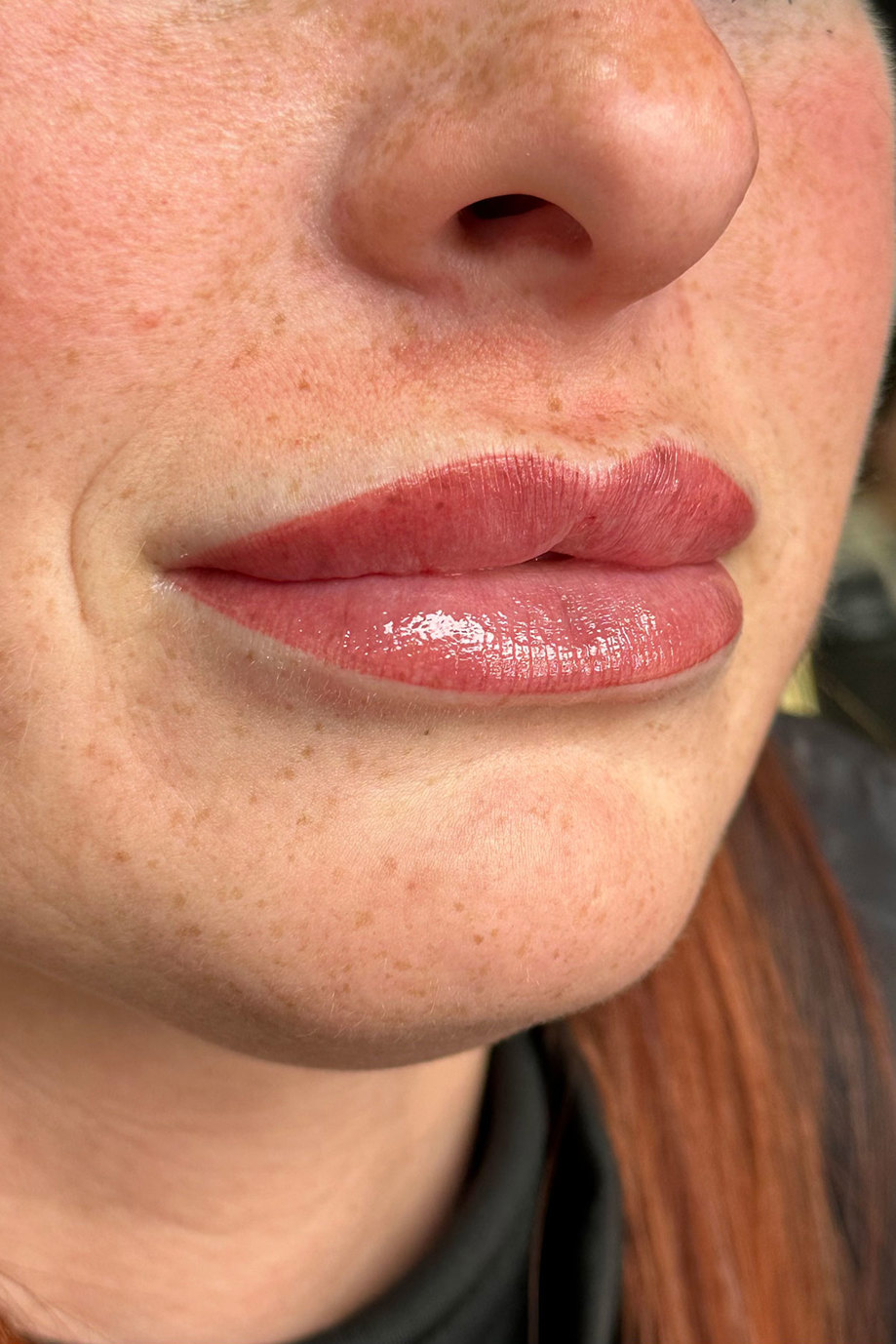 close up view of a woman's red blushed lips