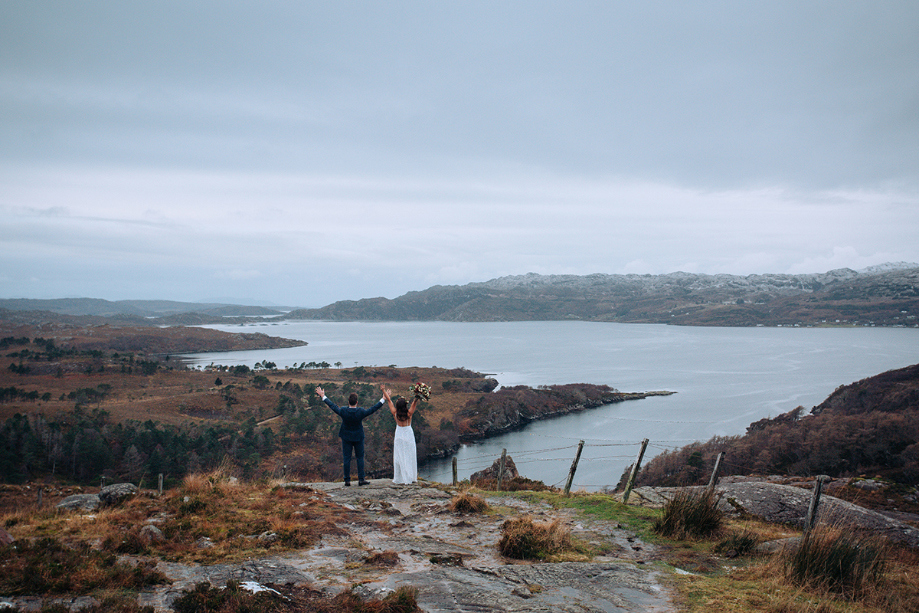 Scenic view of the Scottish Highlands with the couple cheering 