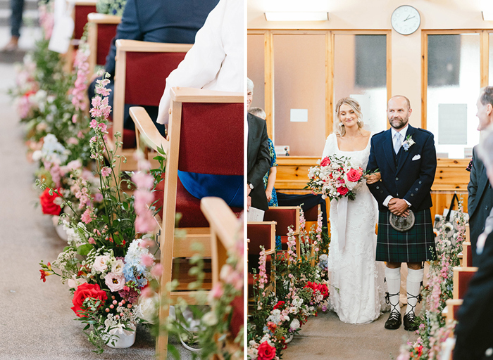 on the left a close up of red, blue, white and pink flowers decorating the side of an aisle, on the right a woman in a wedding dress links arms with a man in a kilt at the edge of the aisle