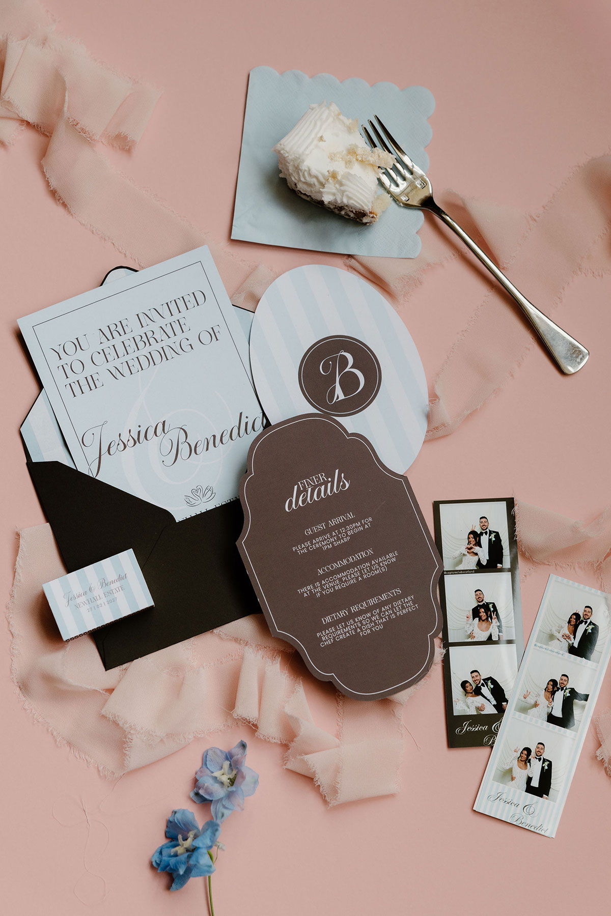 Wedding stationery suite with invitation, details card, ribbon, photo booth strips and a piece of wedding cake