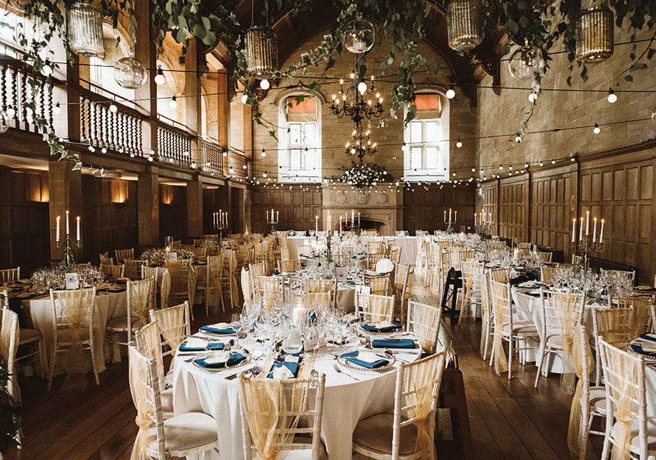 Ballroom at Achnagairn Castle set with round tables for a wedding dinner