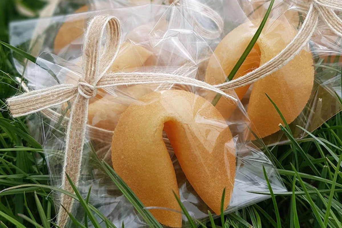 Wrapped fortune cookie wedding favours tied with rustic string