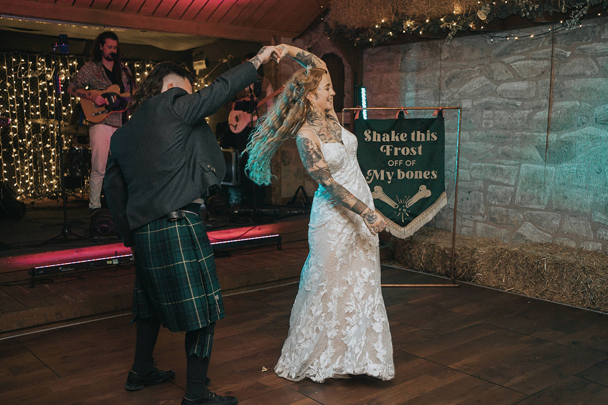 Bride and groom dancing at reception