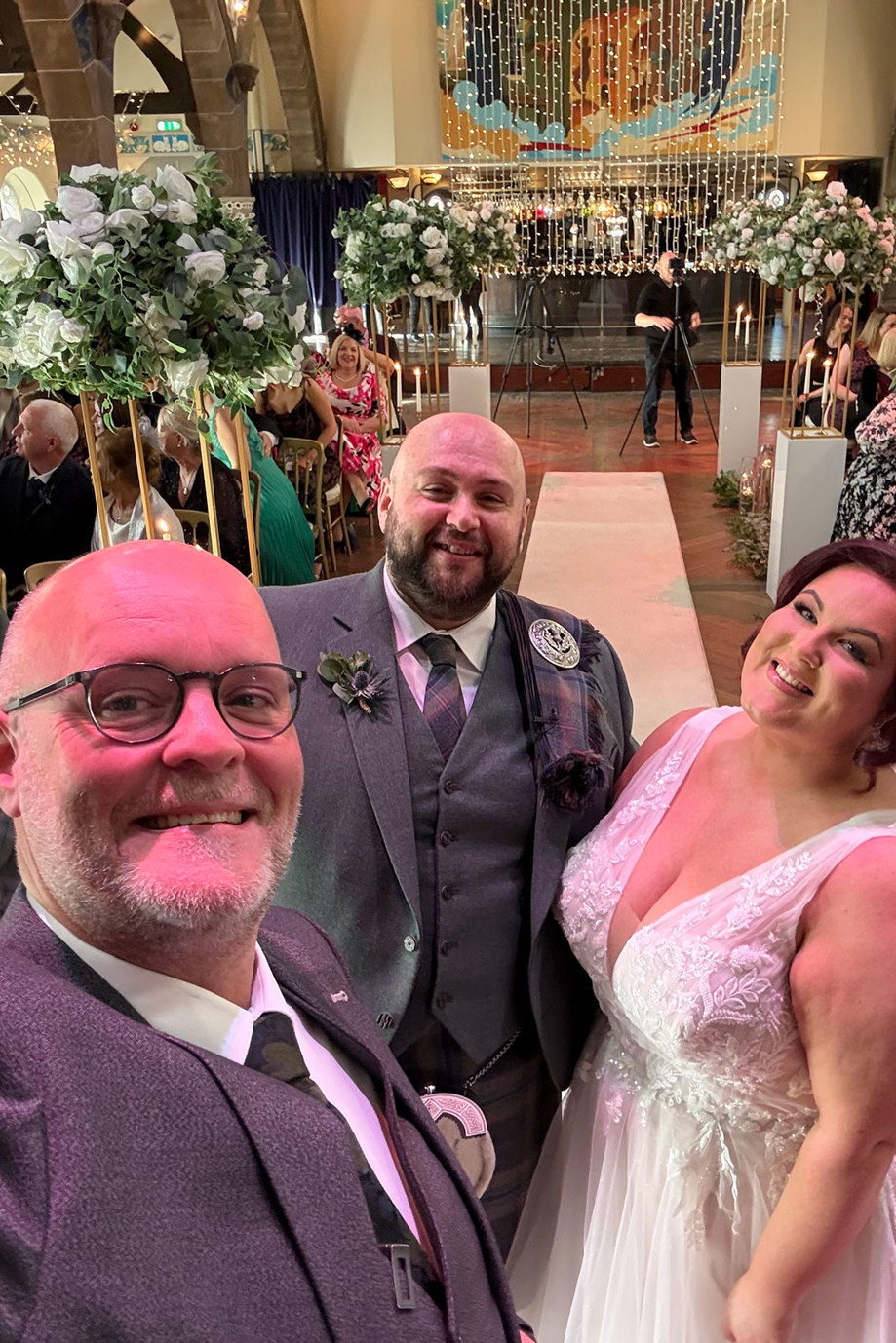 David Smith celebrant with Humanist Society Scotland pictured with a bride and groom