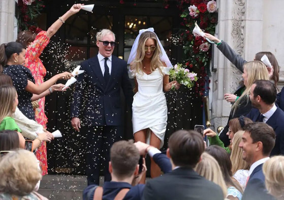 Jamie Laing and Sophie Habboo exit the registry office after getting married to guests throwing confetti