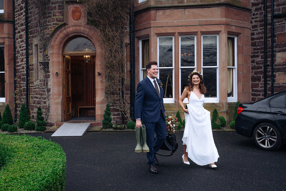 Bride and groom leave their wedding venue