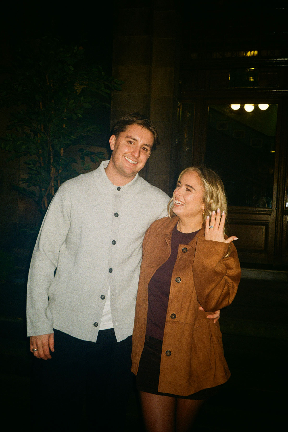 Ruby McFarlane shows her engagement ring while standing with Oskar Wilkie following their Glasgow proposal.