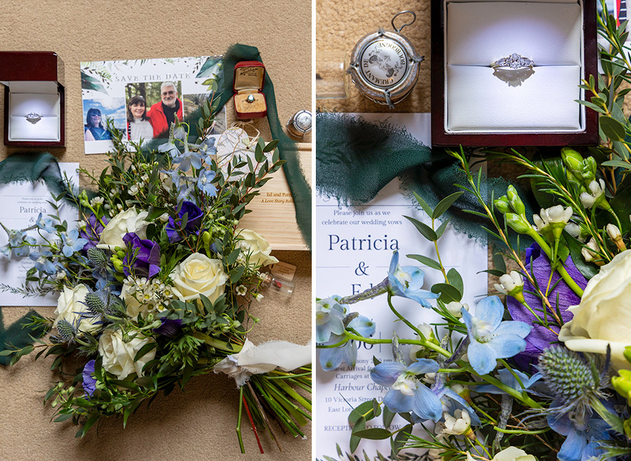 a flat lay of a bouquet of flowers, wedding invite and rings