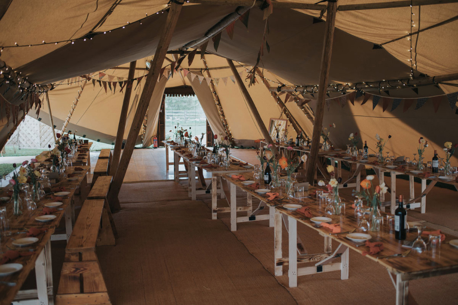 Interior of the teepee with tables set up for the meal