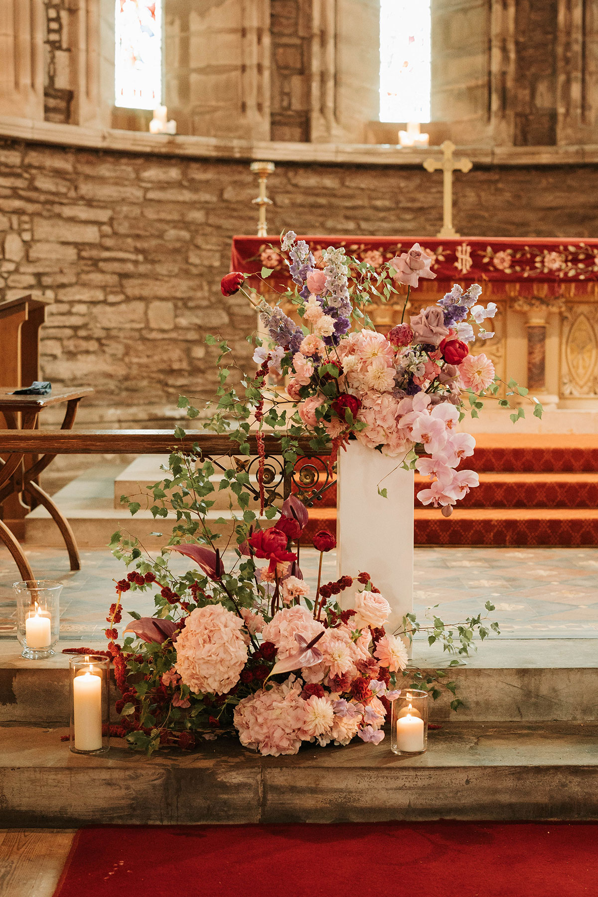 Ceremony pedestal flowers by Kim Dalglish Florist in St Palladius Church at Drumtochty Castle wedding