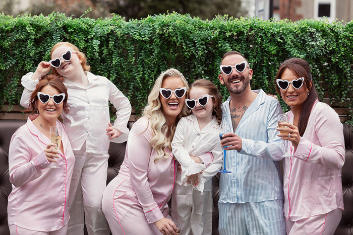 Group Of People Wearing Pyjamas And White Heart Sunglasses