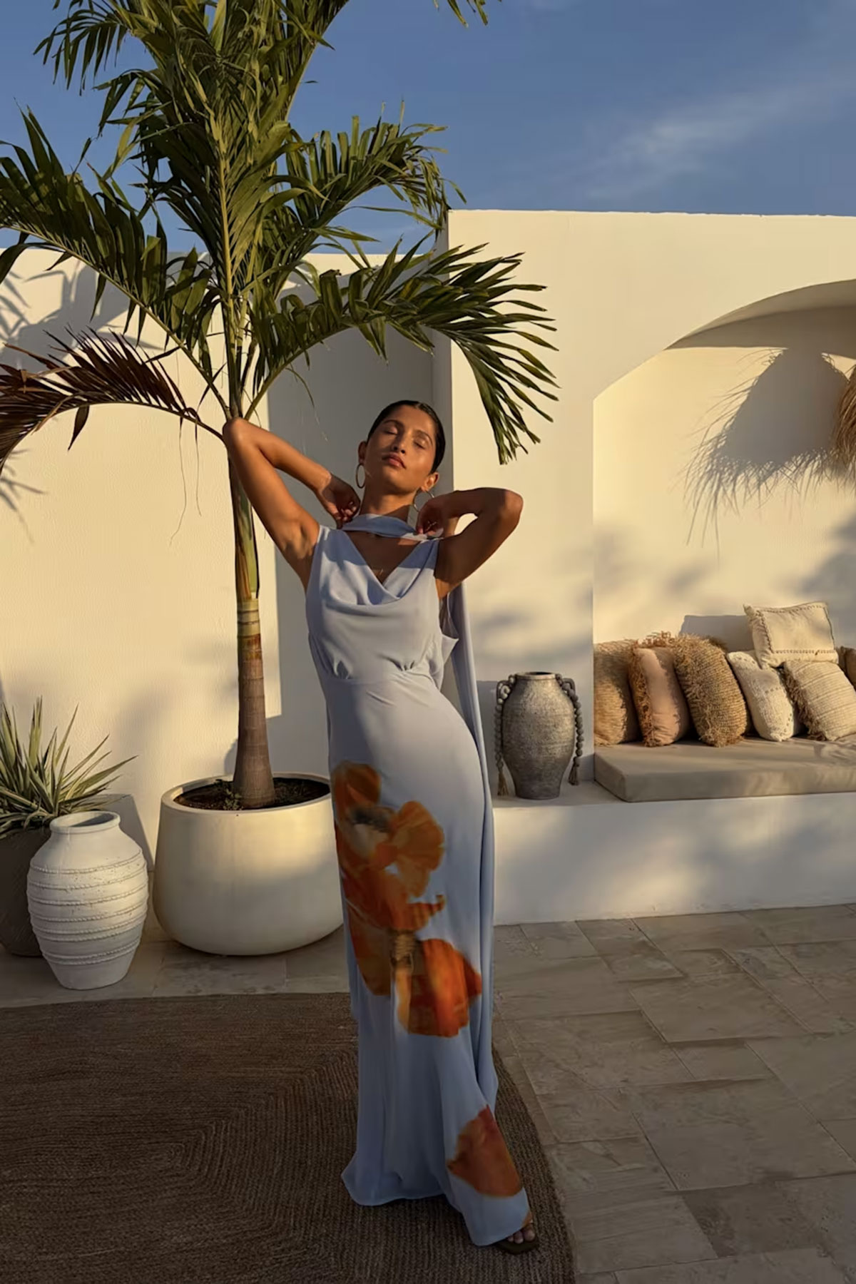 Blue floral cowl-neck maxi dress with scarf detail and draped silhouette