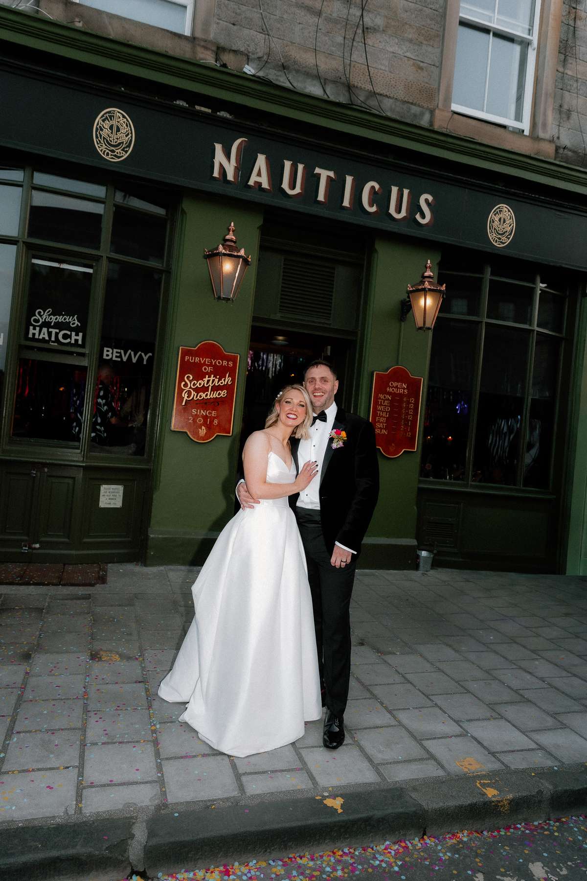 Kara and Rory pose outside Nauticus in Leith during their colourful Edinburgh wedding reception.