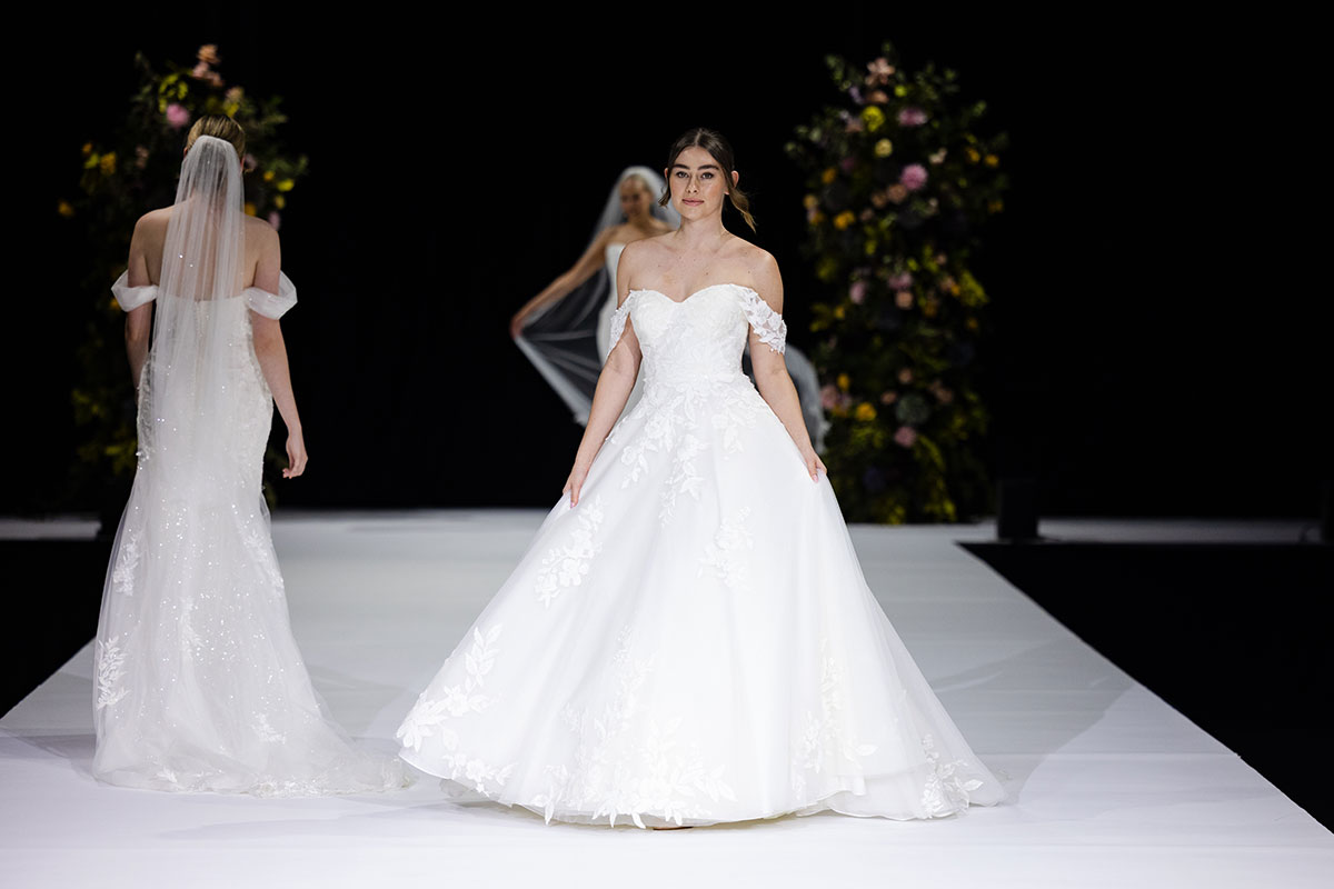 Bridal catwalk show featuring wedding dresses on the Scottish Wedding Show runway