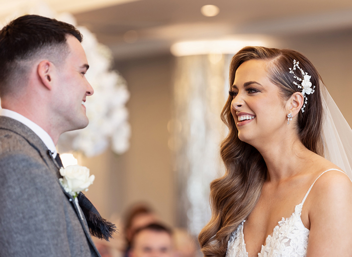 a laughing bride and groom during their wedding ceremony