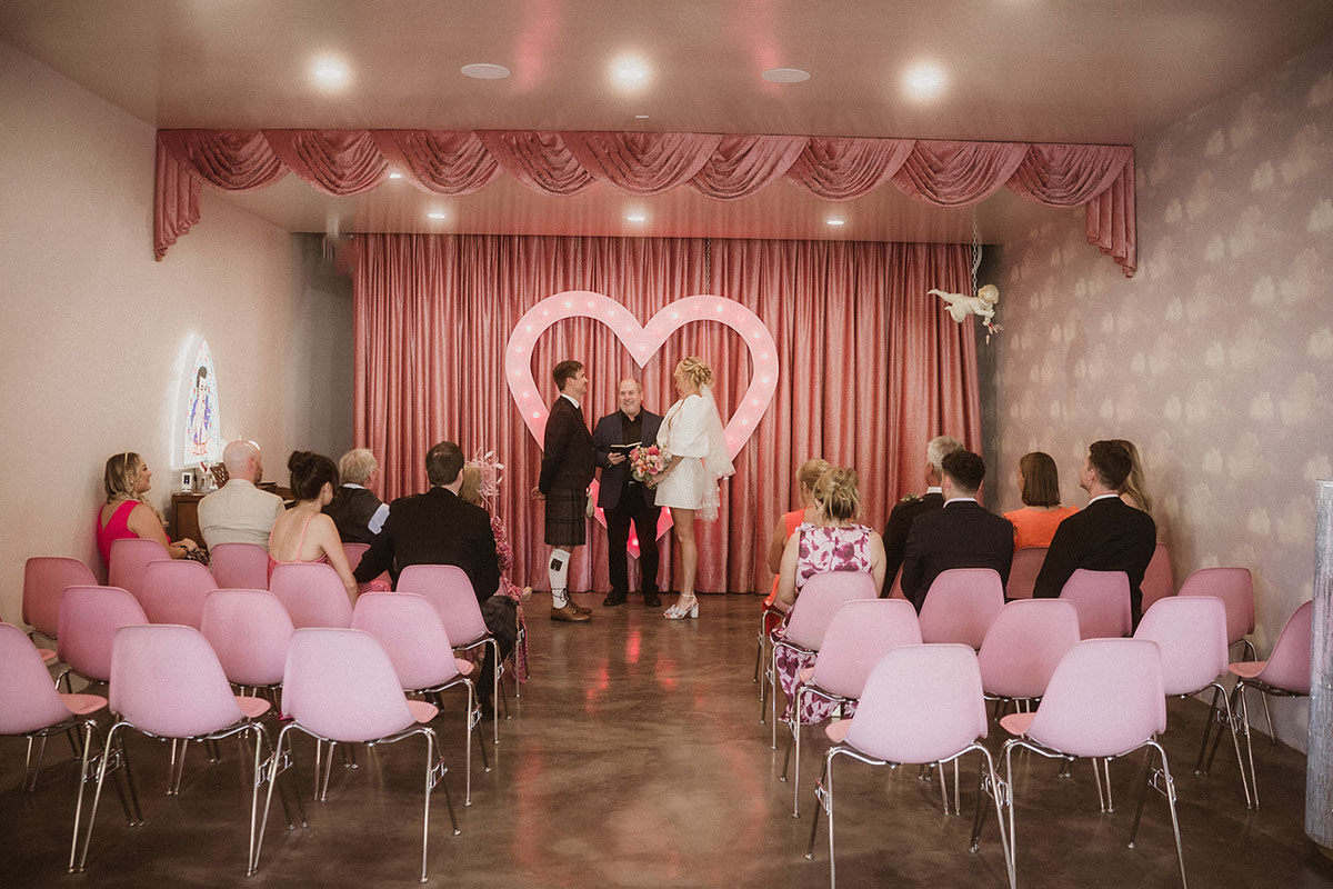 las vegas ceremony with pink chairs and accessories