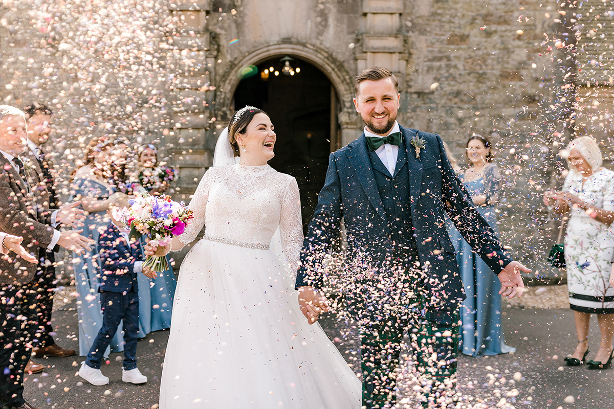 couple with confetti on their wedding day