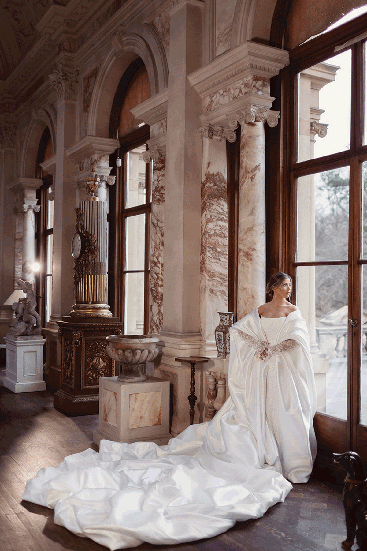 Bridal fashion editorial at Gosford House featuring an off-the-shoulder couture wedding gown with dramatic train and luxurious historic interiors