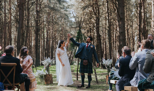 bride and groom have an outdoor woodland ceremony at harvest moon holidays