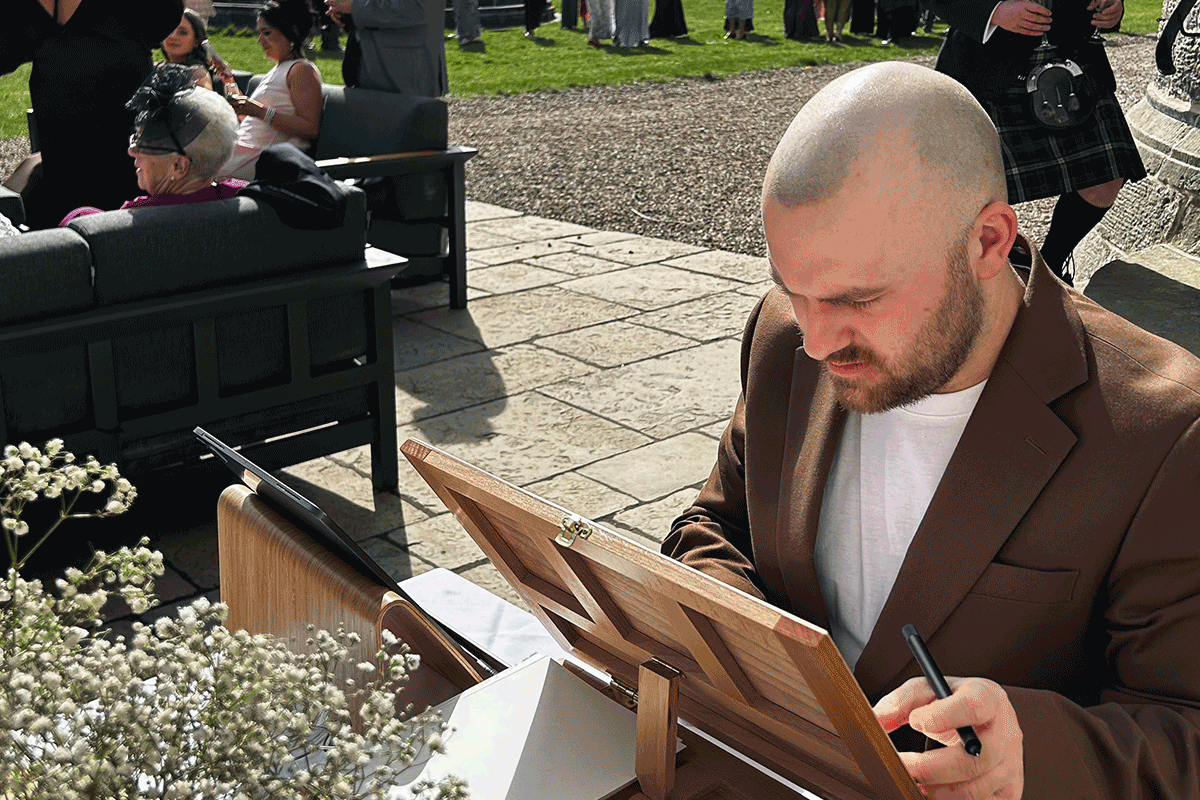 Andrew doing a live wedding illustration