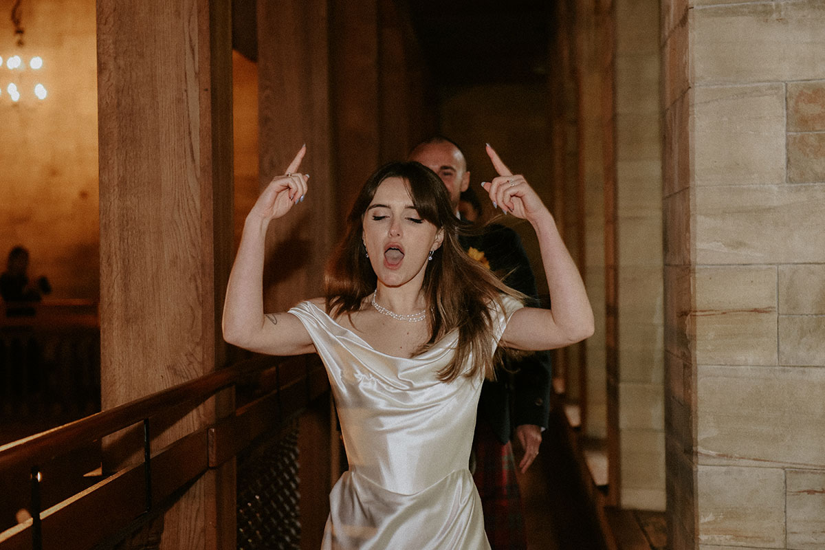a bride and groom entering for dinner at Achnagairn Castle