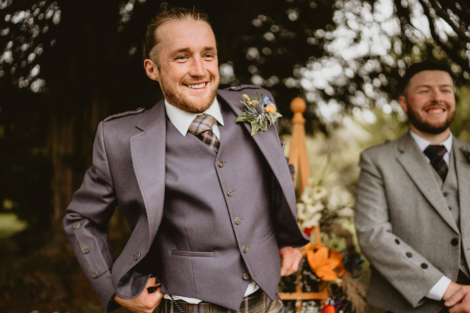 Groom waits for bride before outdoor ceremony