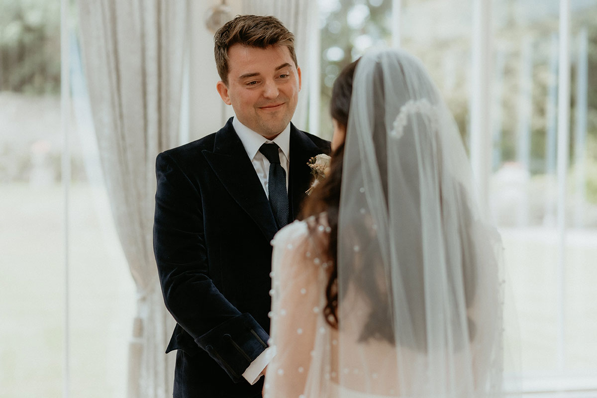 a bride and groom during a wedding ceremony at Carlowrie Castle