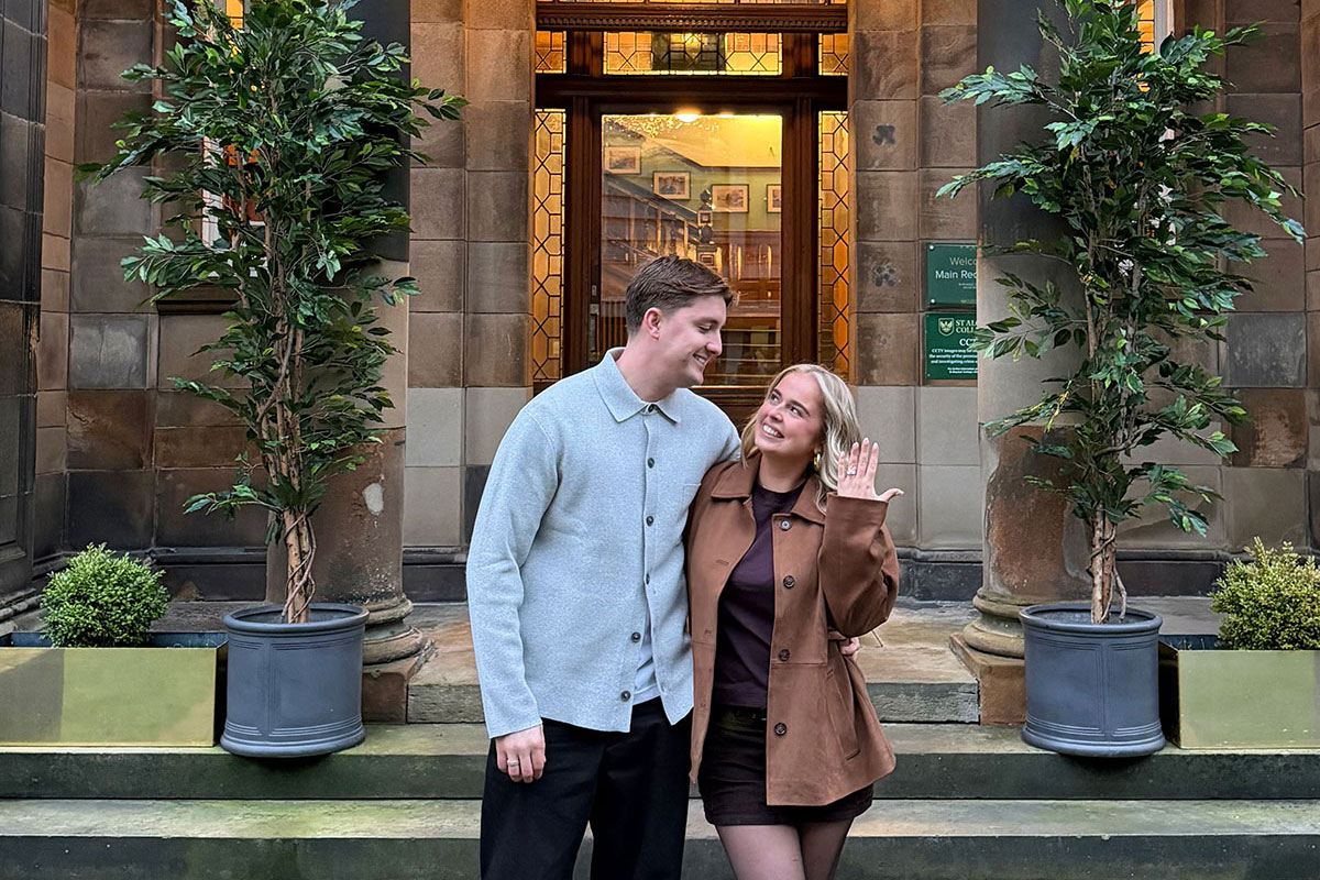 Ruby McFarlane and Oskar Wilkie outside St Aloysius’ College in Glasgow after their engagement, with Ruby showing her engagement ring.