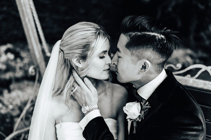 a bride and groom portrait nose-to-nose in garden at Busby Hotel