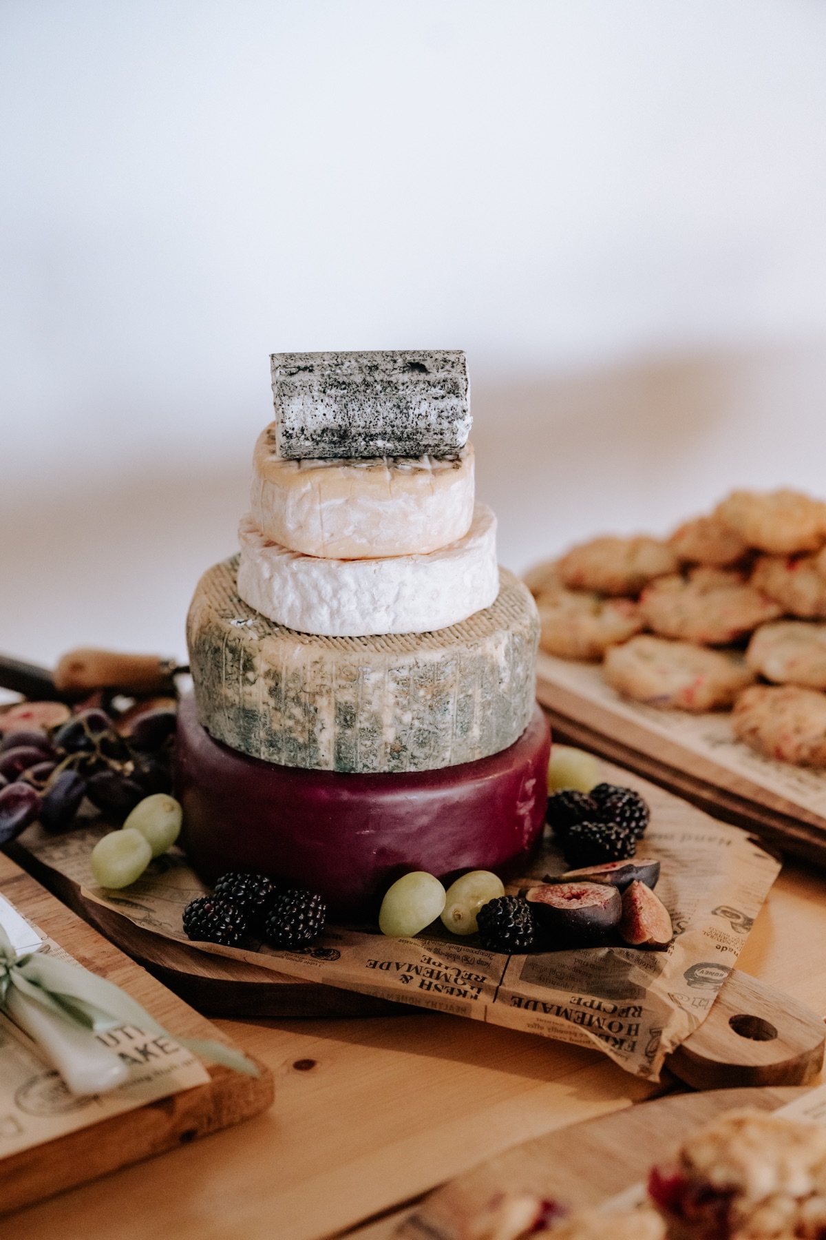 Tiered wedding cheese cake with grapes, figs and blackberries at Hannah and Donna’s Harvest Moon reception.