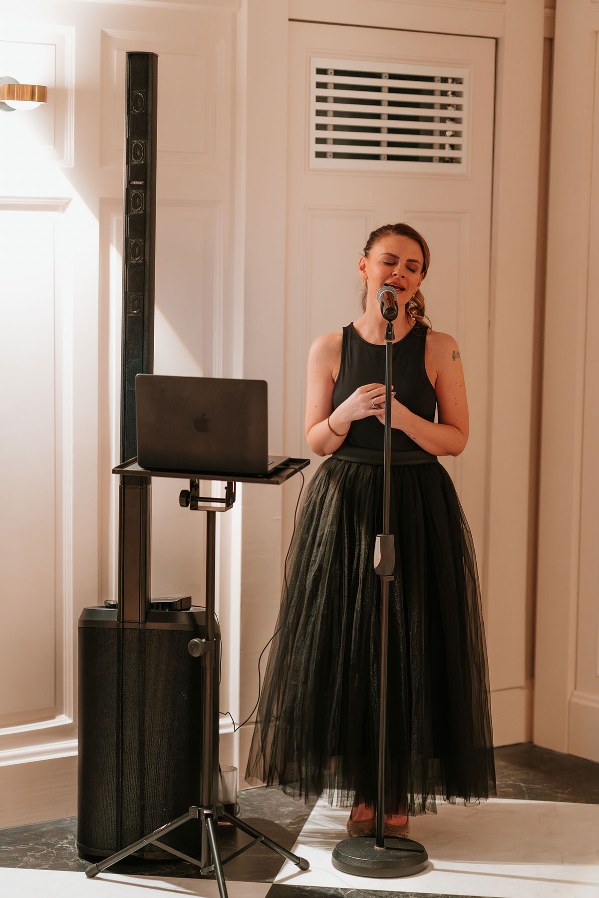 Wedding singer performing during a romantic engagement proposal celebration
