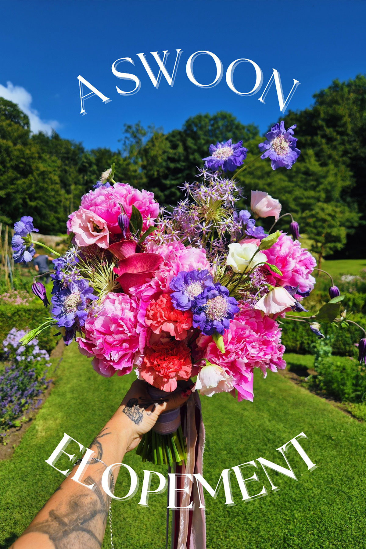 Bright pink, purple and red bridal bouquet outdoors