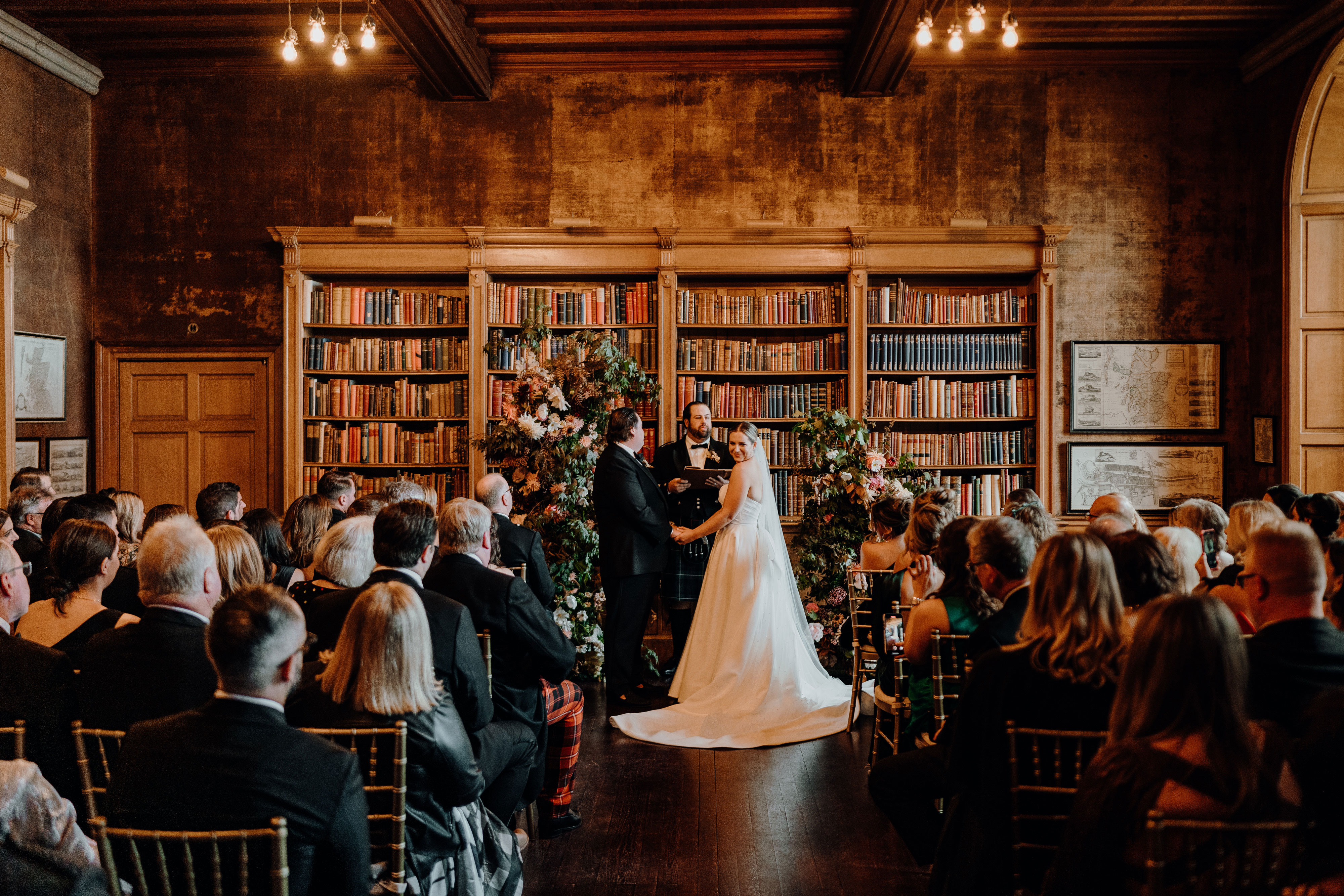 indoor wedding ceremony with bride and groom at barnbougle castle