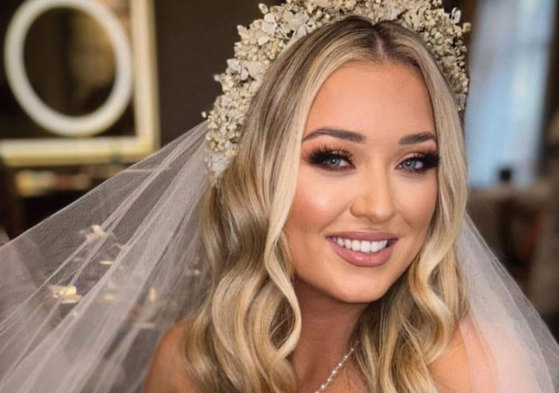 bride with blonde wavy hair and flower crown
