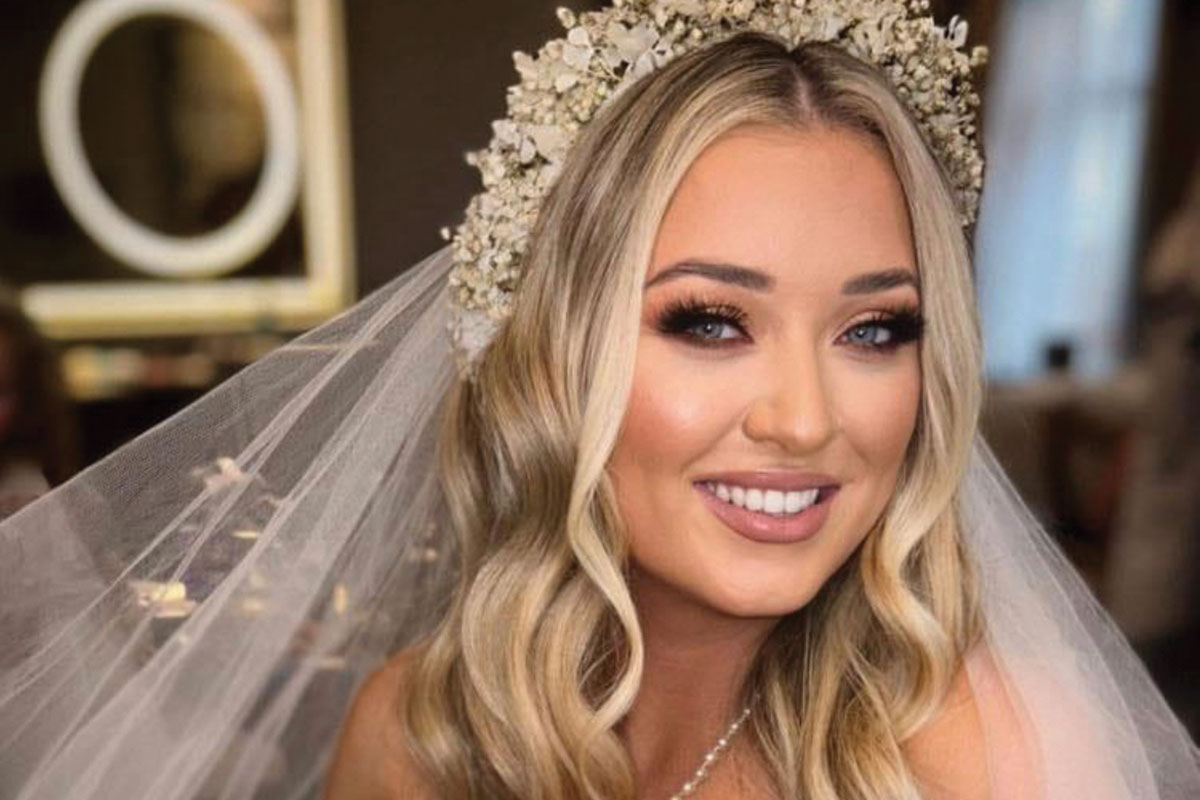 bride with blonde wavy hair and flower crown